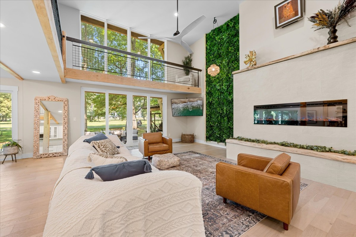 Great room with soaring ceilings and modern fireplace